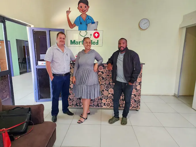 Visitors with Mart Med staff at the clinic