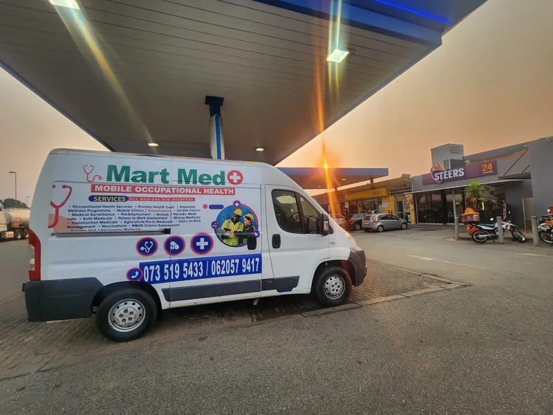 The Mart Med mobile clinic van parked at a service station
