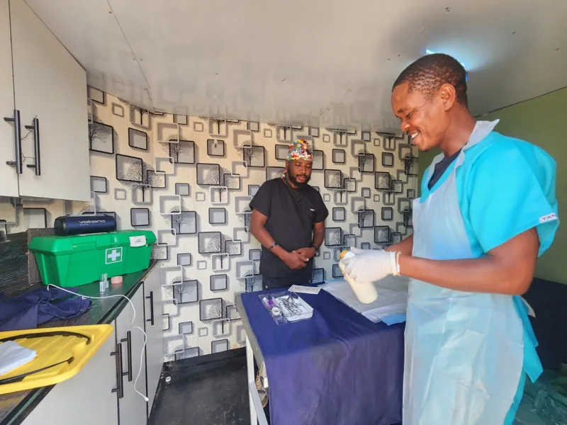 A Mart Med nurse preparing equipment in a consultation room